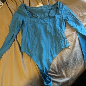 blue long sleeved body suit
